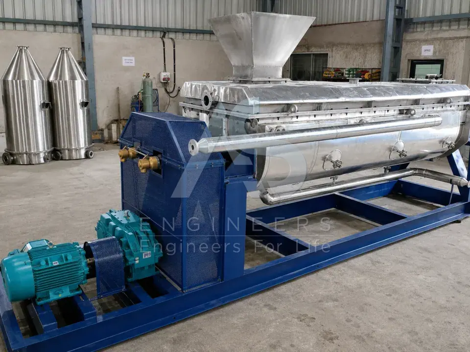 Paddle dryer with feed hopper, heating jacket, gearbox and motor drive